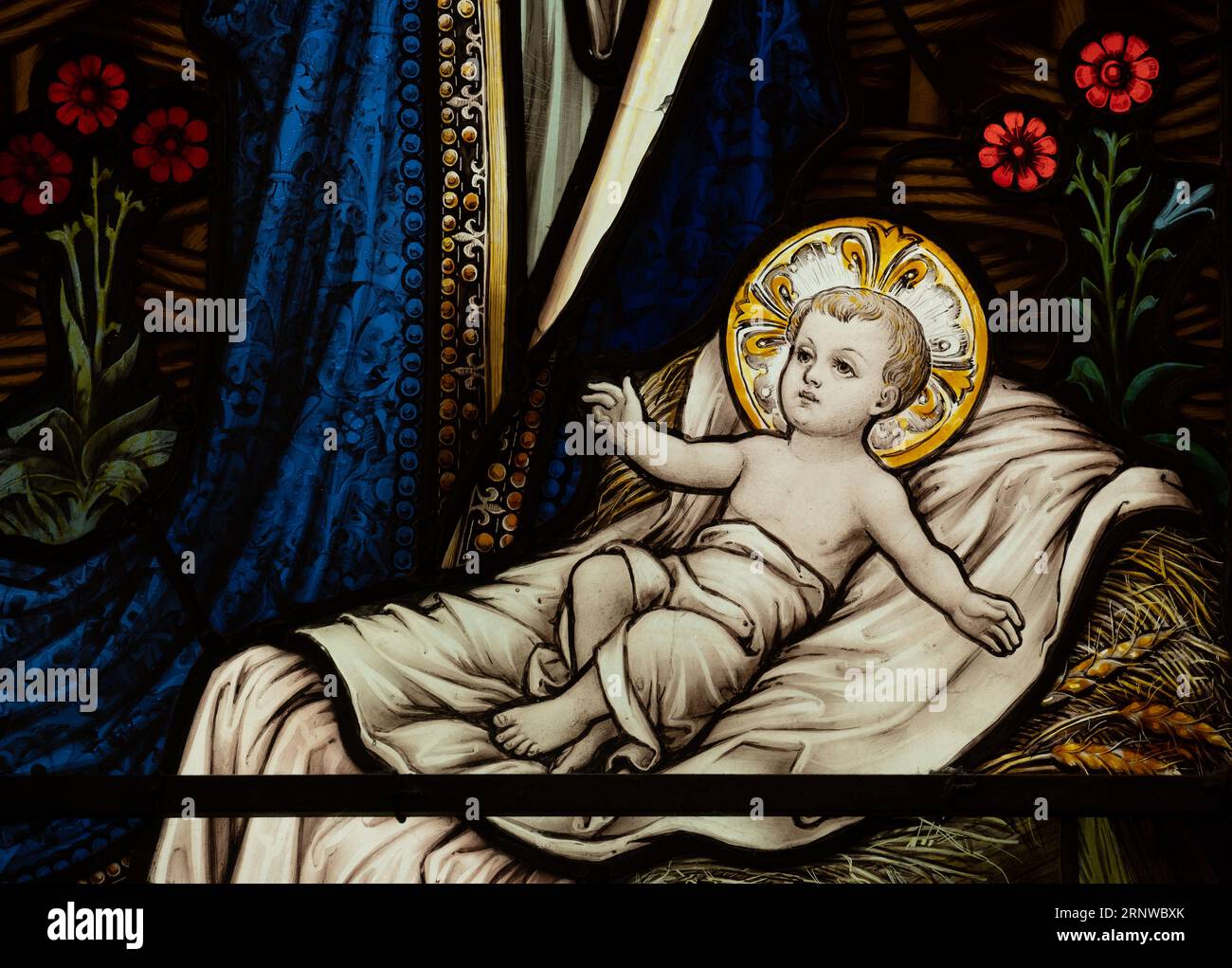 Infant Jesus stained glass,  St. Peter`s Church, Ipsley, Redditch, Worcestershire, UK Stock Photo